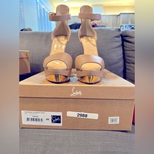 Christian loubuotins size 40. Worn one time to take picture